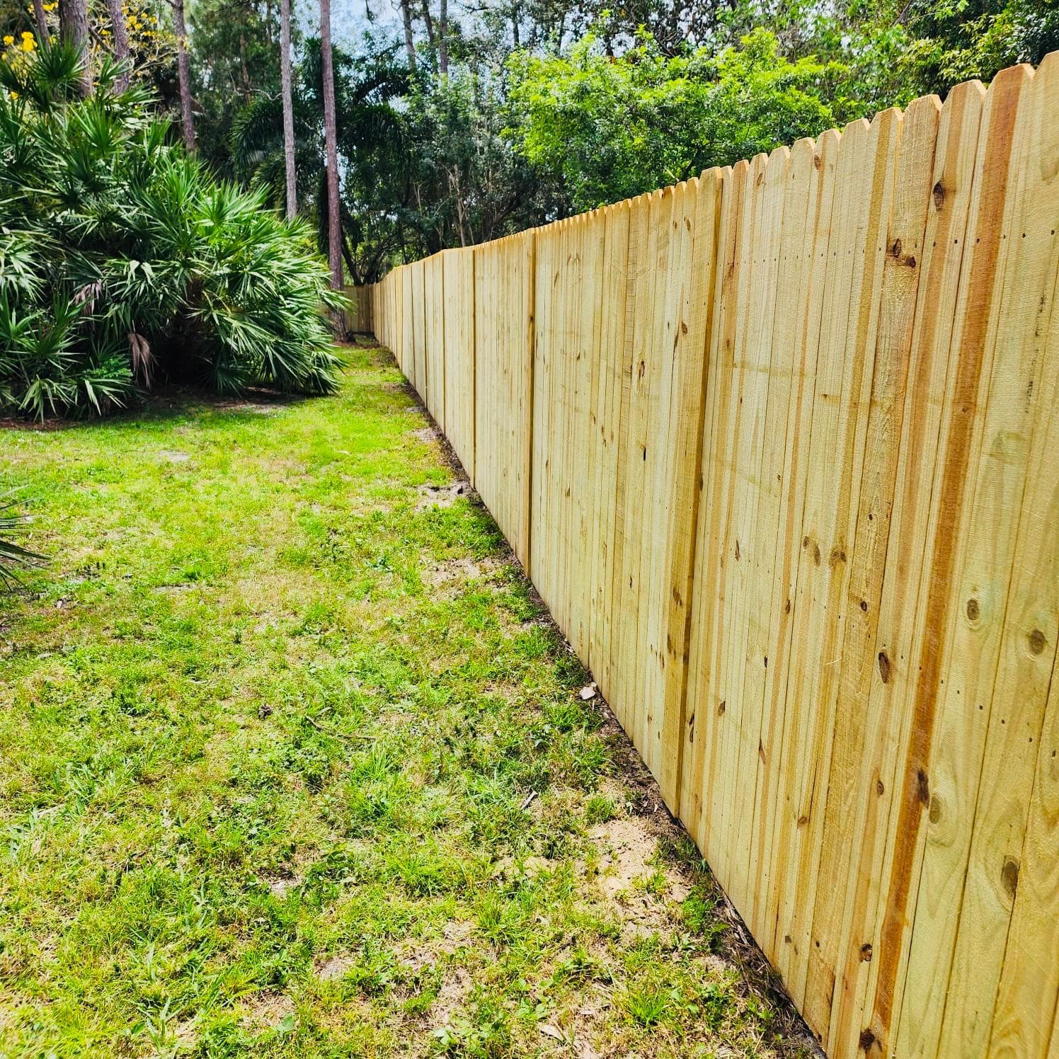 Natural wood privacy fence installed by Benito Fine Carpentry Wellington Florida