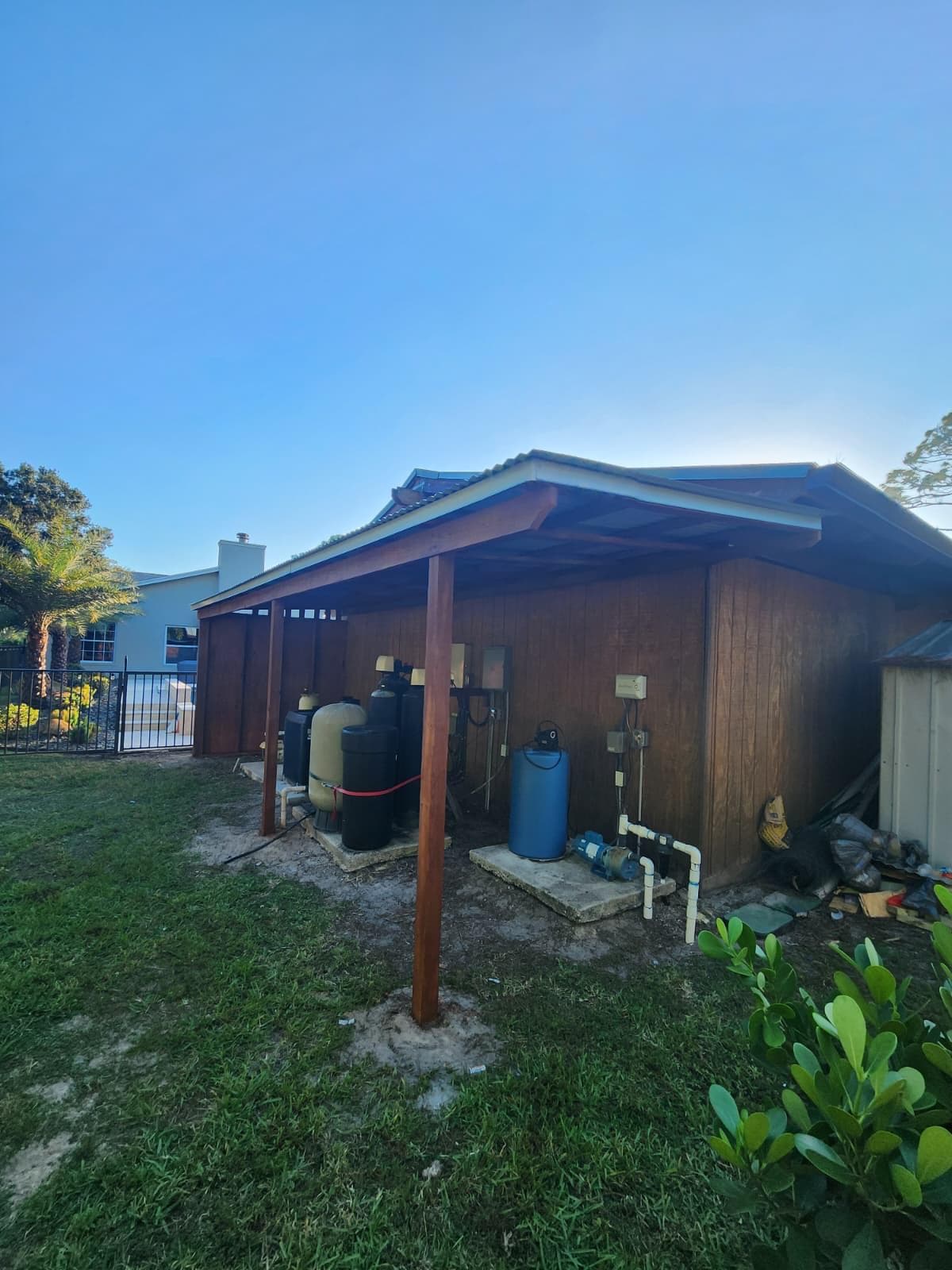 Custom cedar water system cover built by Benito Fine Carpentry in Palm Beach County FL